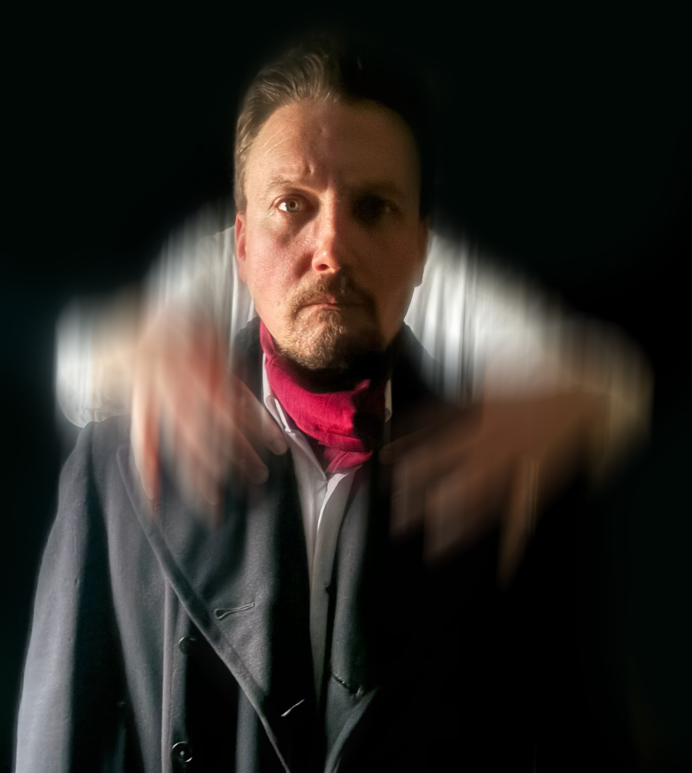 image2 A somber man with ghostly hands on his shoulders